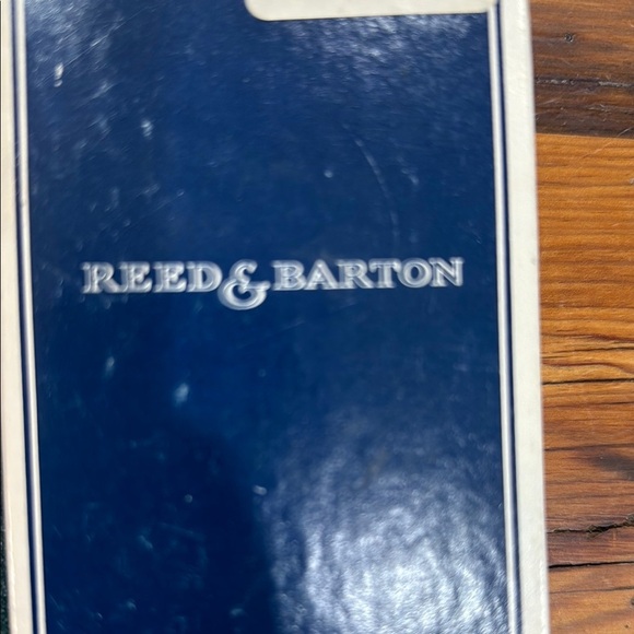 Reed & Barton Silver Bell with Toddler holding a sock - Picture 2 of 7